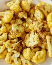 <p>Cauliflower, when broken up into florets, kind of already resembles popcorn (you can't unsee it!), so we decided to lean into that with this recipe. We added turmeric and clarified butter (or ghee) to get the iconic look and taste of buttered popcorn. Try swapping in coconut oil to make it dairy-free too.</p><p>Get the <strong><a href="https://www.delish.com/cooking/recipe-ideas/a37246428/cauliflower-air-fryer-recipe/" rel="nofollow noopener" target="_blank" data-ylk="slk:Air Fryer Cauliflower recipe;elm:context_link;itc:0;sec:content-canvas" class="link ">Air Fryer Cauliflower recipe</a></strong>.</p>