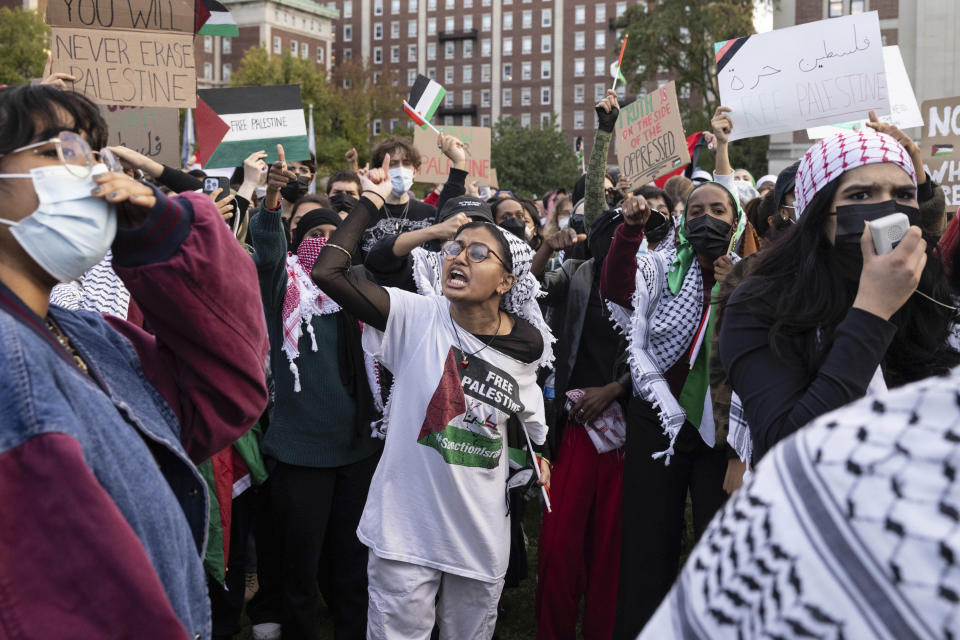 FIle- Palestinian supporters gather for a protest at Columbia University, Thursday, Oct. 12, 2023, in New York. As the death toll rises in the Israel-Hamas war, American colleges have become seats of anguish with many Jewish students calling for strong condemnation after civilian attacks by Hamas while some Muslim students are pressing for recognition of decades of suffering by Palestinians in Gaza. (AP Photo/Yuki Iwamura, File)