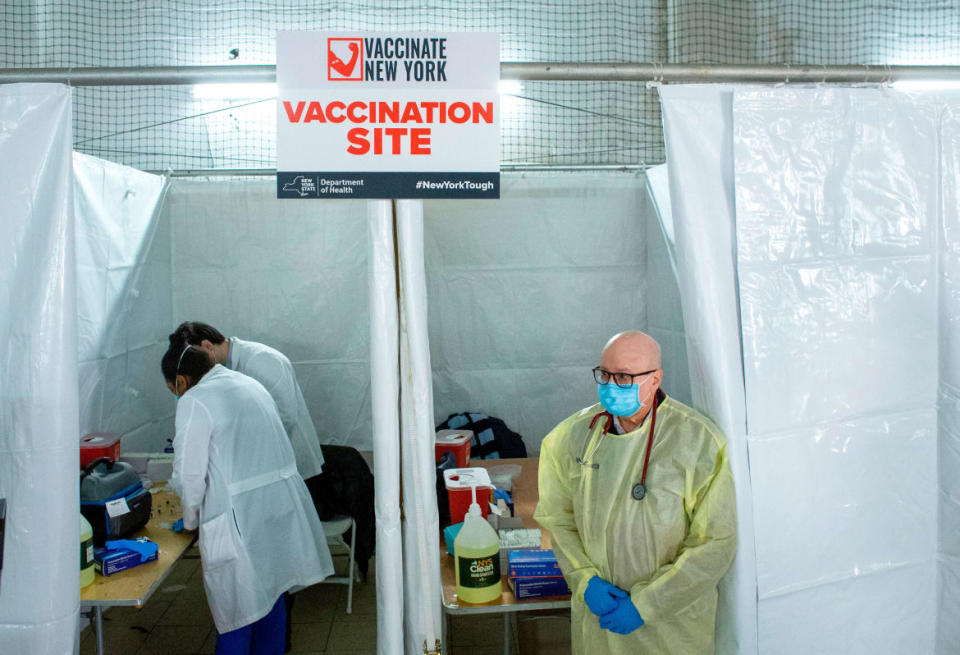 <div class="inline-image__title">1230601329</div> <div class="inline-image__caption"><p>Health workers wait for patients to administer Pfizer Covid-19 vaccines at the opening of a new vaccination site at Corsi Houses in Harlem New York on January 15, 2021. - Pfizer expects lower coronavirus vaccine deliveries for a stretch beginning in late January in order to lift output later this winter and throughout 2021, the drugmaker said January 15. </p></div> <div class="inline-image__credit">KENA BETANCUR/Getty</div>