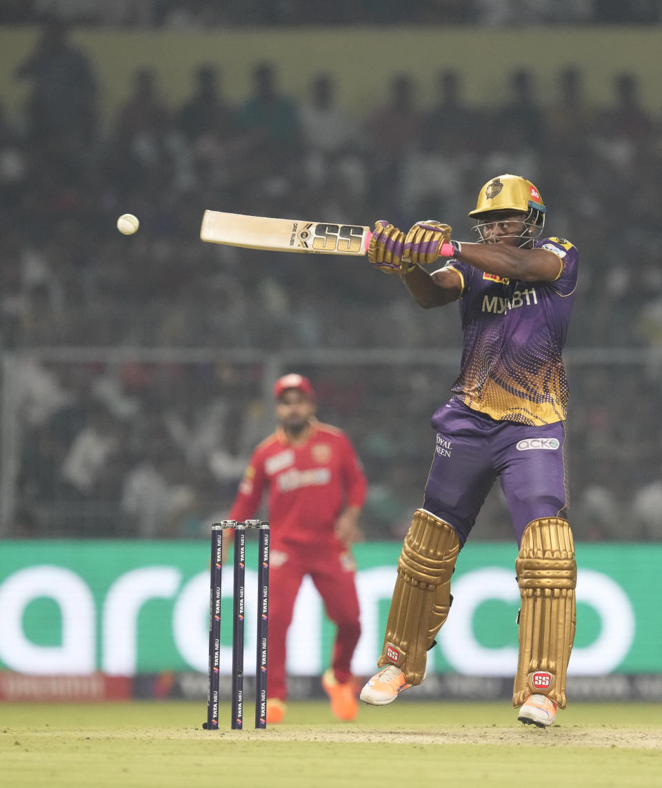 Kolkata Knight Riders' Andre Russell plays a shot during Indian Premier League cricket match between Kolkata Knight Riders and Punjab Kings, in Kolkata, India, Monday, May 8, 2023. (AP Photo Bikas Das )