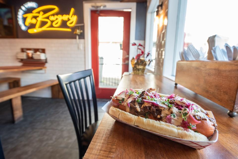 The Dam Dog, a customer favorite at The Burgerly in New Hope, comes topped with pulled BBQ brisket chili, pickled cabbage and spicy mayo.