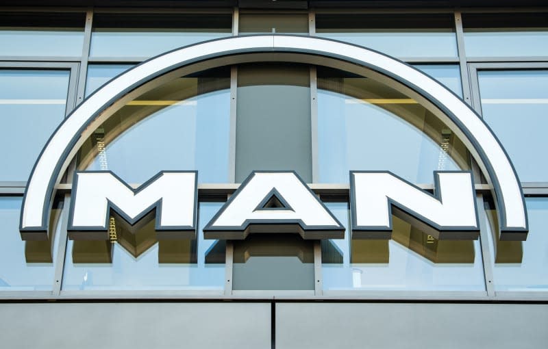 The MAN logo hangs on the façade of an office building in Parkstadt Schwabing, in the north of the Bavarian capital. The Volkswagen Group's lorry and bus subsidiary, Traton, saw commercial vehicle orders drop by 21% last year, after a very strong 2022. Incoming orders totalled 264,800 vehicle in 2023, the Munich-based company announced on 22 January. Peter Kneffel/dpa