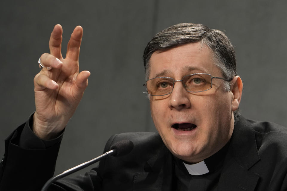 Mons. Marco Mellino talks during the presentation of the long-awaited reform program of the Holy See bureaucracy, during a press conference at the Vatican, Monday March 21, 2022. Pope Francis released "Praedicate Evanglium," or "Proclaiming the Gospel," a 54-page text that replaces the founding constitution "Pastor Bonus" penned by St. John Paul II in 1988. At center is Mons. Marco Mellino. (AP Photo/Domenico Stinellis)