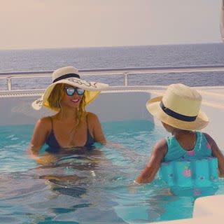 The Carter family is clearly still living their best lives. Beyoncé continues to post vacation snaps to Instagram, this time sharing cute candids of her 3-year-old daughter, Blue Ivy, and husband, Jay Z, as well as her own banging bikini bod. <strong>WATCH: Blue Ivy Shows Off Her Awesome Dance Moves During Vacation</strong> The 34-year-old singer posted photos of her family enjoying their holiday on Italy's Amalfi Coast on Saturday. One photo shows the "Drunk in Love" singer and her little girl in matching straw hats as they sit in a swimming pool aboard a luxury yacht. Another captures a sweet father-daughter moment, with the 45-year-old hip hop mogul giving Blue Ivy a kiss on her cheek. Besides the family-friendly photos, Beyoncé also showed off her "surfboart" body, posing in a sleek one-piece with a sexy plunging neckline and cutouts. This vacay has been all about romance, rest and relaxation for the Carters, as Queen Bey has been seen jet-skiing, sipping champagne and indulging in a little PDA with her hubby. <strong>WATCH: Beyoncé and Jay Z Pack on the PDA</strong> Though she's usually fiercely private, Beyoncé has been proudly showing off her family and their vacation in a number of Instagram posts these past weeks, leaving the rest of us with a serious case of FOMO. Check out more of Beyoncé's Kodak moments from her Roman holiday with Jay Z and Blue Ivy in the video below.