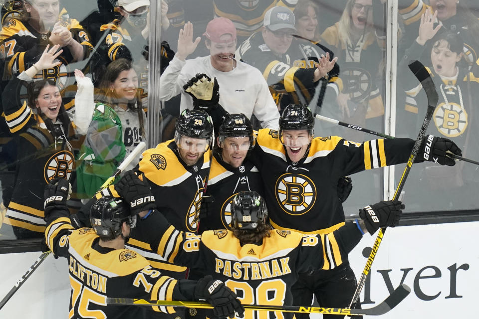 Boston Bruins left wing Taylor Hall, right, celebrates after his goal against the Florida Panthers during the first period of an NHL hockey game, Tuesday, April 26, 2022, in Boston. (AP Photo/Charles Krupa)