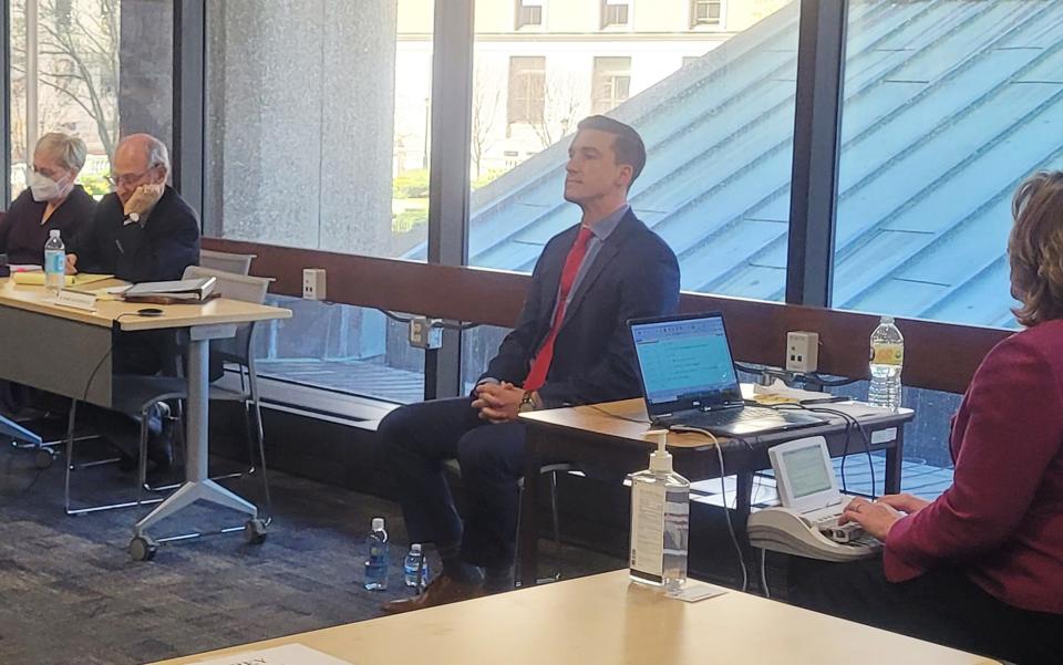 Trooper Ryan Sceviour, center, testifies at the ongoing state Ethics Commission hearing in Boston Friday.