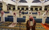 Muslims perform the Al-Fajr prayer inside the Al-Rajhi Mosque while practicing social distancing, after the announcement of the easing of lockdown measures amid the coronavirus disease (COVID-19) outbreak, in Riyadh