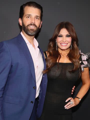 <p>Astrid Stawiarz/Getty</p> Donald Trump Jr. and his girlfriend Kimberly Guilfoyle pose backstage for Zang Toi fashion show on February 13, 2019 in New York City.