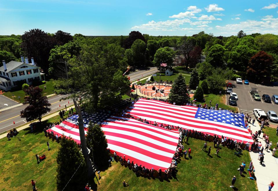 Memorial Day 2019 was one to remember in Middleboro with the unfurling of two 90-foot American flags - the Mount Rushmore flag and World War 2 flag - on the Town Hall lawn at the conclusion of the annual parade and observances. This year, the Memorial Day events are back on, with the exception of the parade, after a year off in 2020 due to the pandemic.