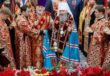 Metropolitan of Kiev and All Ukraine Onufry (Onufriy), the Primate of the Ukrainian Orthodox Church of the Moscow Patriarchate, conducts a memorial service at the Tomb of Unknown Soldier in Kiev, Ukraine May 9, 2018. Picture taken May 9, 2018. REUTERS/Valentyn Ogirenko