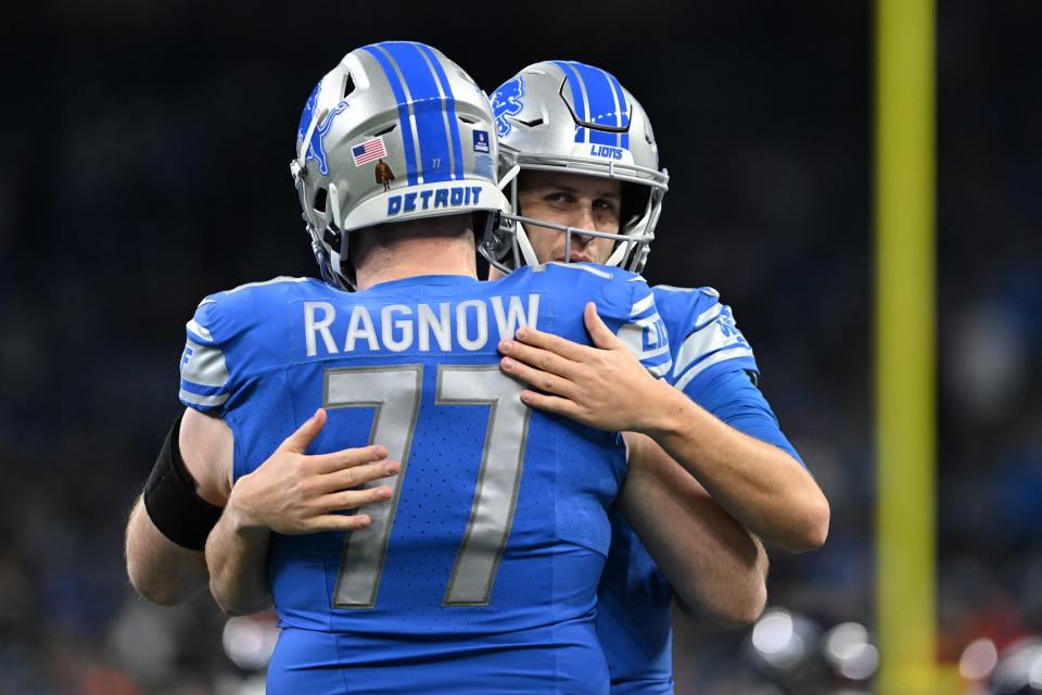Dec 16, 2023; Detroit, Michigan, USA; Detroit Lions quarterback Jared Goff (16) hugs center Frank Ragnow (77) during pregame warmups before a game against the Denver Broncos at Ford Field. Mandatory Credit: Lon Horwedel-USA TODAY Sports