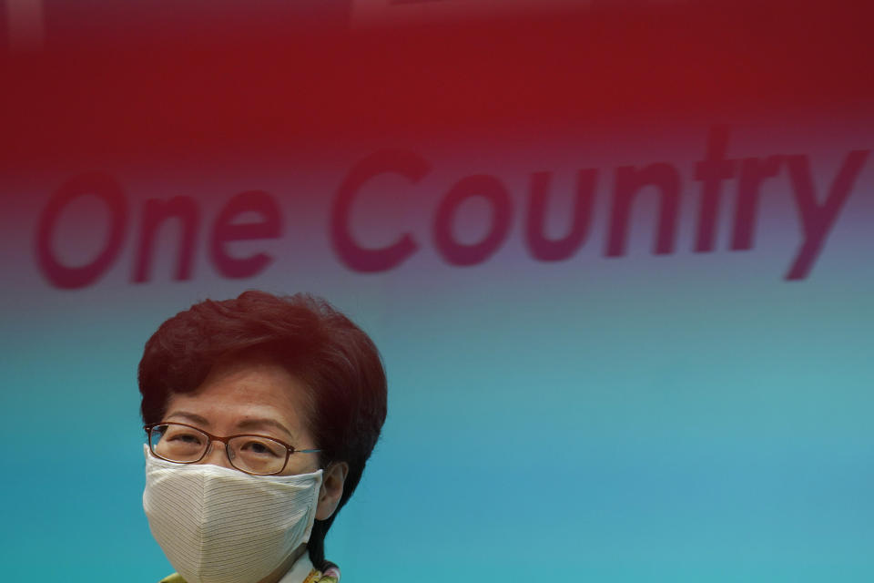 Hong Kong Chief Executive Carrie Lam listens to reporters' questions during a press conference in Hong Kong, Tuesday, June 2, 2020. Lam hit out at the "double standards" of foreign governments over national security, and pointed to recent unrest in America as an example. (AP Photo/Vincent Yu)