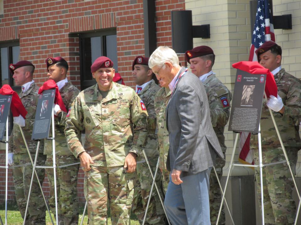 Retired Lt. Gen. Jack Nix, far right, is congratulated by Command Sgt. Maj. Randolph Delapena, after being inducted into the 82nd Airborne Division Hall of Fame during a ceremony Wednesday, May 24, 2023, at Fort Bragg.