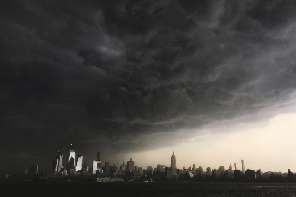 Storm clouds gather over New York City. (Photo: Denis Paquin/AP)