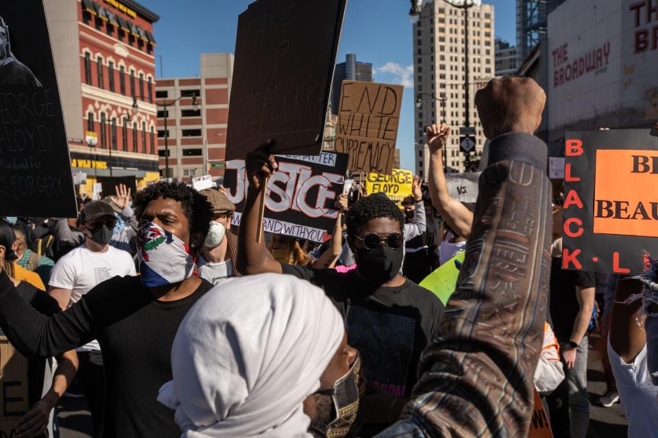 Protesters march through downtown Detroit on Sunday, May 31, 2020, against police brutality and justice for George Floyd on the third day of protesting in Detroit.