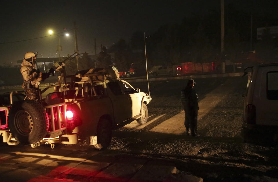 <p>Security forces stand guard near the Intercontinental Hotel after a deadly attack in Kabul, Afghanistan, Jan. 20, 2018. (Photo: Massoud Hossaini/AP) </p>