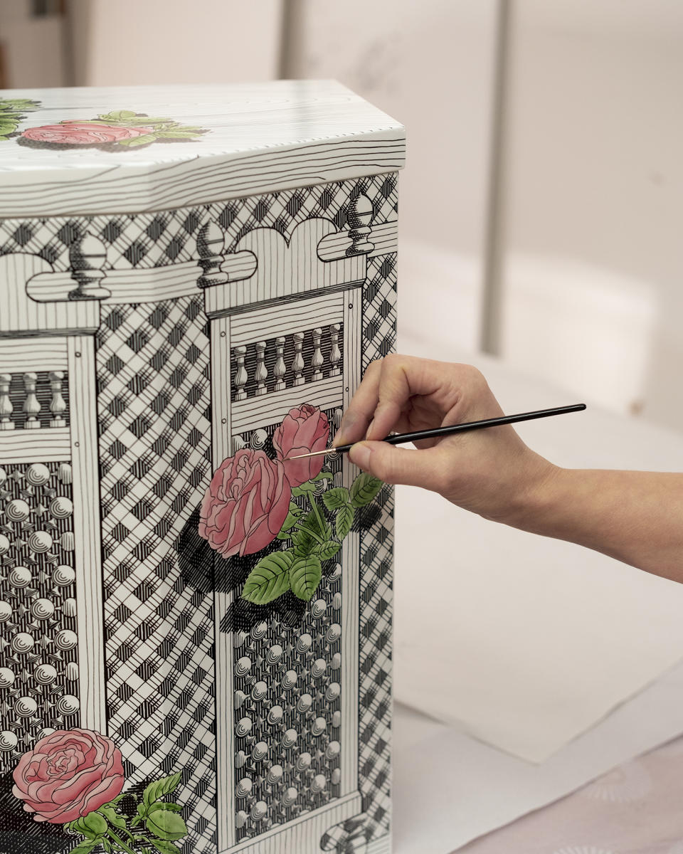 An artist paints Fornasetti's Musciarabia, rose pattern onto its latest collection. Fornasetti Courtesy photo.