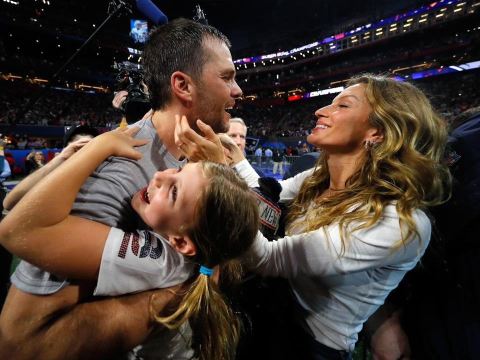 Tom Brady #12 of the New England Patriots celebrates with his wife Gisele Bündchen after the Super Bowl LIII against the Los Angeles Rams at Mercedes-Benz Stadium on February 3, 2019 in Atlanta, Georgia.