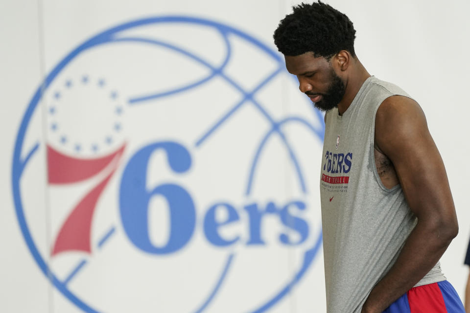 Philadelphia 76ers' Joel Embiid walks across the court after a practice at the NBA basketball team's facility, Friday, Oct. 22, 2021, in Camden, N.J. (AP Photo/Matt Rourke)