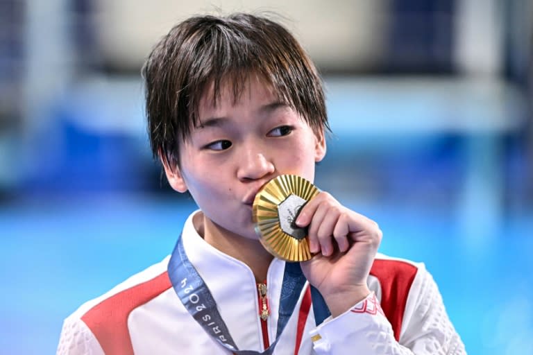 Olympic diving gold medallist Quan Hongchan has been the focus of intense interest from obsessive fans, who have mobbed her rural home town (Manan VATSYAYANA)