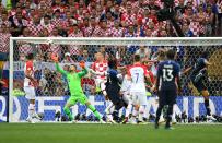 <p>Mario Mandzukic of Croatia scores an own goal past team mate Danijel Subasic, to make it 1-0 to France. (Photo by Shaun Botterill/Getty Images) </p>