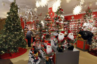 In this Tuesday, Nov. 5, 2019, photo shoppers browse the Holiday Lane section at the Macy's flagship store, in New York. With three weeks until the official start of the holiday shopping season, the nation’s retailers are gearing up for what will be another competitive shopping period. (AP Photo/Richard Drew)