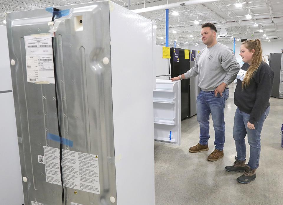 Daniel and Colleen Hymes of New Franklin shop for a new refrigerator Tuesday at the new Lowe's Outlet in the Chapel Hill Plaza in Cuyahoga Falls.