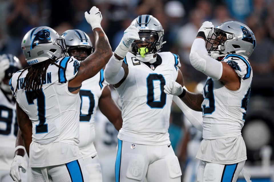 CHARLOTTE, NORTH CAROLINA - SEPTEMBER 18: Frankie Luvu #49 of the Carolina Panthers celebrates with his teammates after sacking Derek Carr #4 of the New Orleans Saints during the first quarter in the game at Bank of America Stadium on September 18, 2023 in Charlotte, North Carolina. (Photo by Jared C. Tilton/Getty Images)