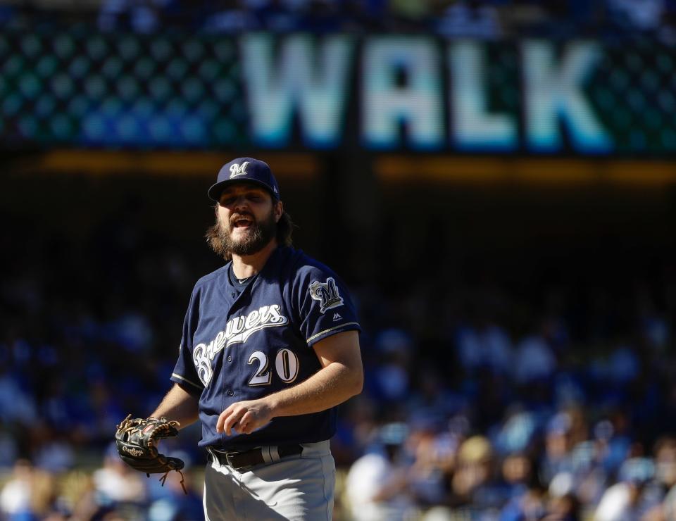 Milwaukee Brewers starting pitcher Wade Miley reacts after giving up a walk during the first inning of Game 5 of the National League Championship Series baseball game against the Los Angeles Dodgers Wednesday, Oct. 17, 2018, in Los Angeles.