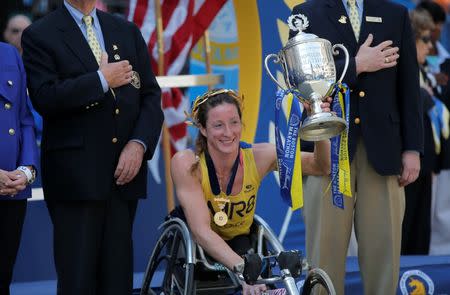 Tatyana McFadden of the United States accepts the first place trophy after winning women's wheelchair division of the 120th Boston Marathon in Boston, Massachusetts April 18, 2016. REUTERS/Brian Snyder