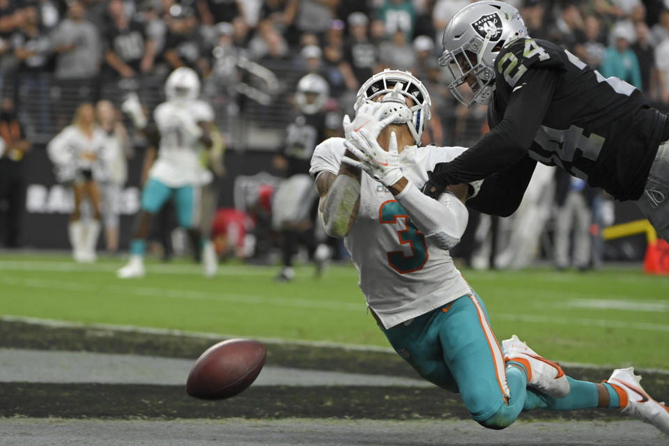 Miami Dolphins wide receiver Will Fuller (3) misses a catch attempt in the end zone against Las Vegas Raiders defensive back Johnathan Abram (24) during overtime of an NFL football game, Sunday, Sept. 26, 2021, in Las Vegas. (AP Photo/David Becker)