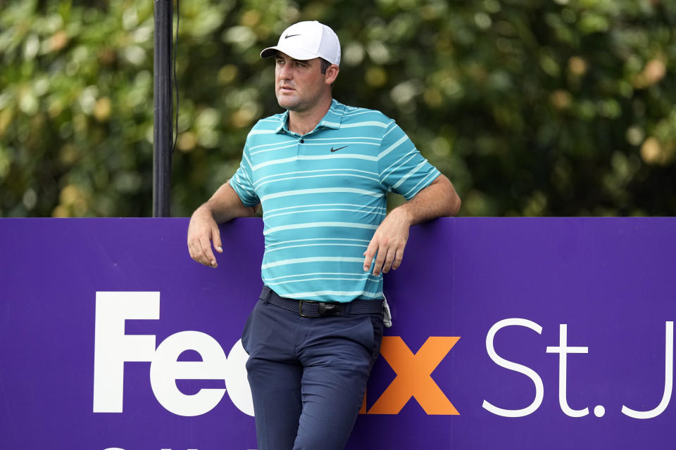 Scottie Scheffler rests on the eighth tee during the second round of the St. Jude Championship golf tournament Friday, Aug. 11, 2023, in Memphis, Tenn. (AP Photo/George Walker IV)