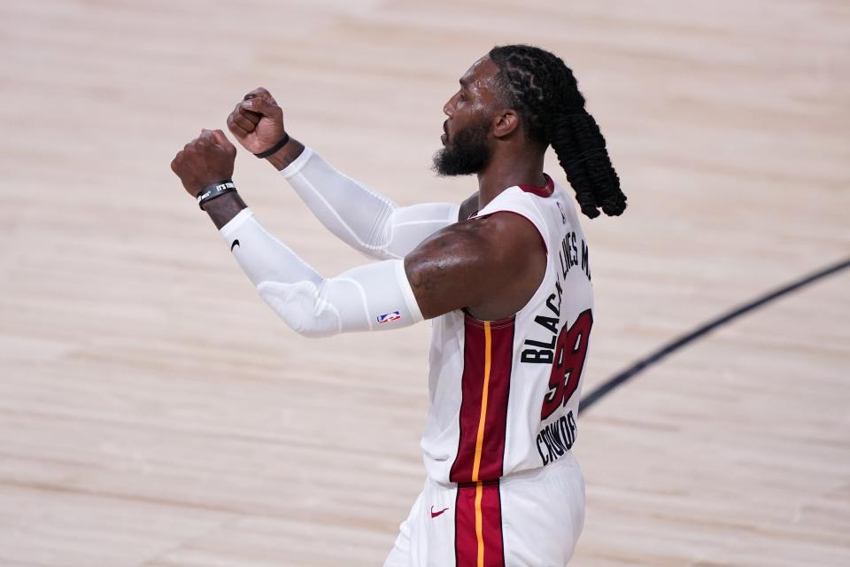 Miami Heat forward Jae Crowder (99) celebrates late in the second half of an NBA conference final playoff basketball game against the Boston Celtics on Thursday, Sept. 17, 2020, in Lake Buena Vista, Fla. (AP Photo/Mark J. Terrill)