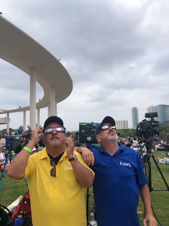 KXAN's Ed Zavala and Jim Spencer watch the total solar eclipse from the Long Center in Austin, Texas, on April 8. (KXAN Photo)