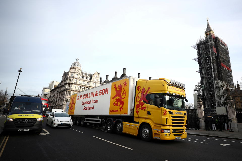 A lorry drives during a protest against post-Brexit bureaucracy that hinders exports to the European Union, at the Parliament Square in London, Britain, January 18, 2021. REUTERS/Hannah McKay