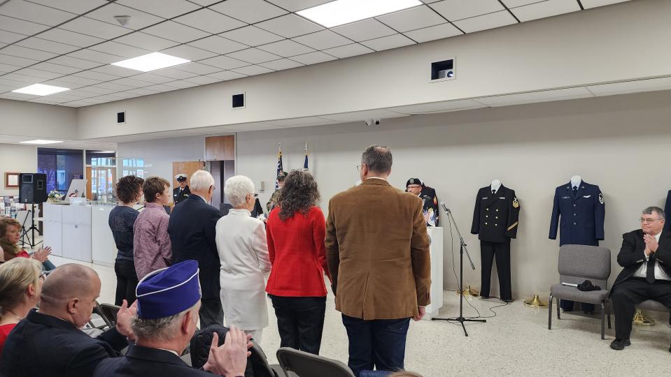 Gold Star families stand to be honored for their families' sacrifices Friday during the Veterans Day Ceremony at the Texas Panhandle War Memorial Center.