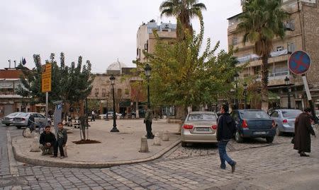 People walk in al-Jdeideh neighbourhood, in the Old City of Aleppo, Syria December 12, 2009. REUTERS/Khalil Ashawi/Files