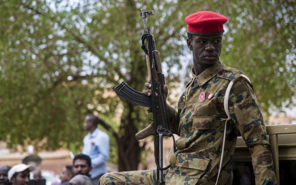 Soldiers are stationed at the trial of ousted former Sudanese President Omar al-Bashir  - Mahmoud Hjaj/Anadolu Agency via Getty Images