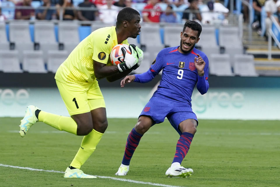 Trinidad and Tobago goalkeeper Marvin Phillip blocks a shot by United States forward Jesús Ferreira during the first half of a CONCACAF Gold Cup soccer match on Sunday, July 2, 2023, in Charlotte, N.C. (AP Photo/Chris Carlson)