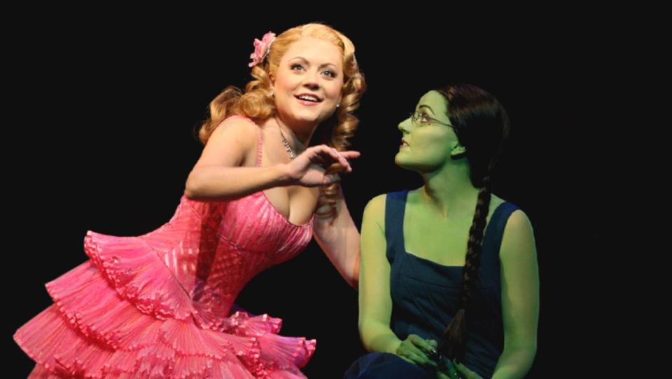 Glinda and Elphaba sitting together, an example of queer witches