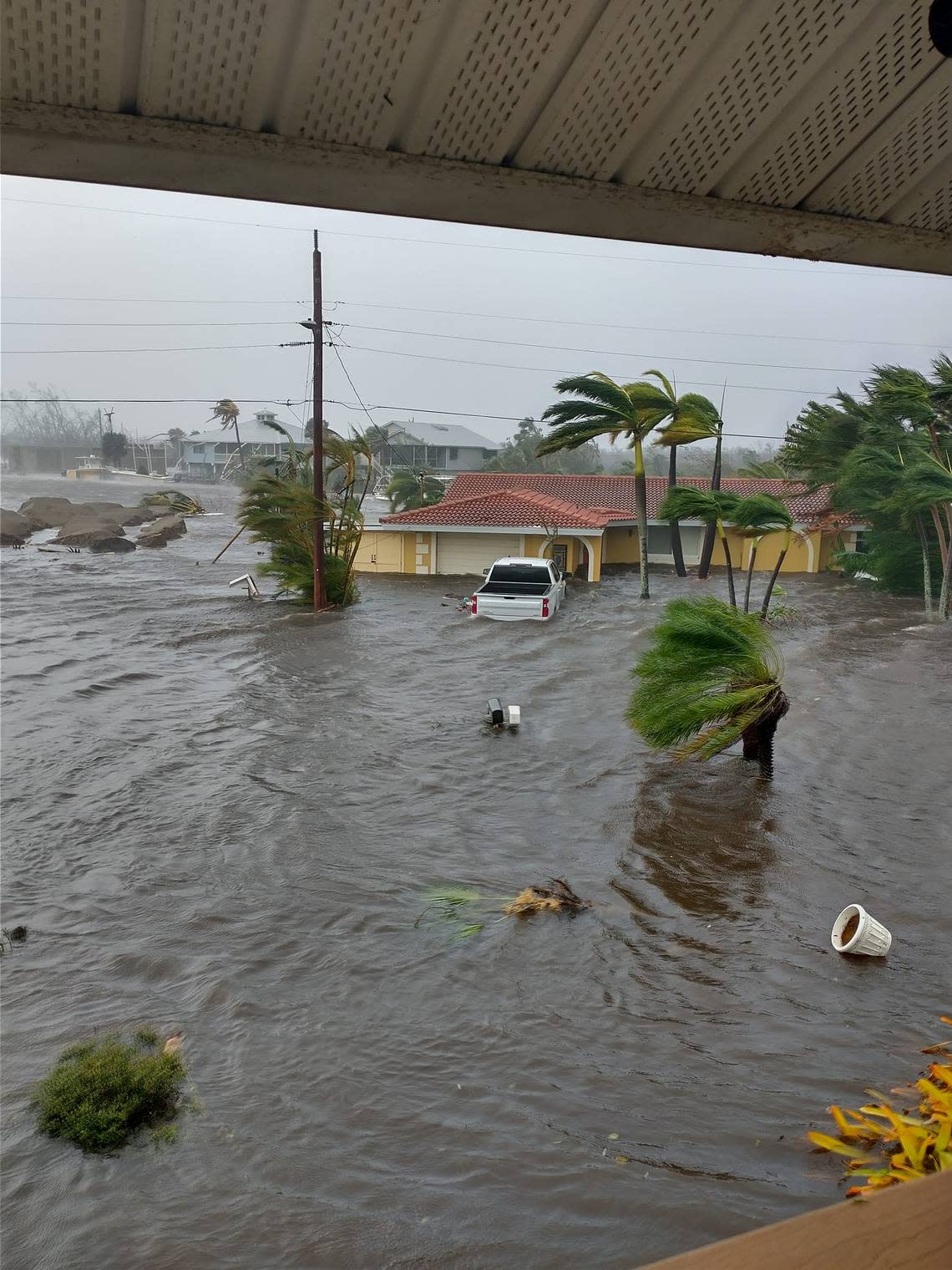 The storm surge barrels through St. James City in Pine Island, Florida, on Wednesday afternoon, Sept. 28, 2022. Hurricane Ian hit Southwest Florida as a powerful Category 4 storm.