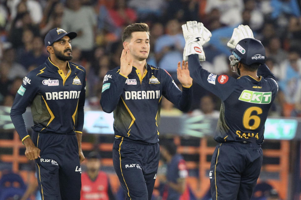 Gujarat Titans' Noor Ahmad, center, celebrates the wicket of Punjab Kings' Prabhsimran Singh during the Indian Premier League cricket match between Gujarat Titans and Punjab Kings in Ahmedabad, India, Thursday, April 4, 2024. (AP Photo/STR)