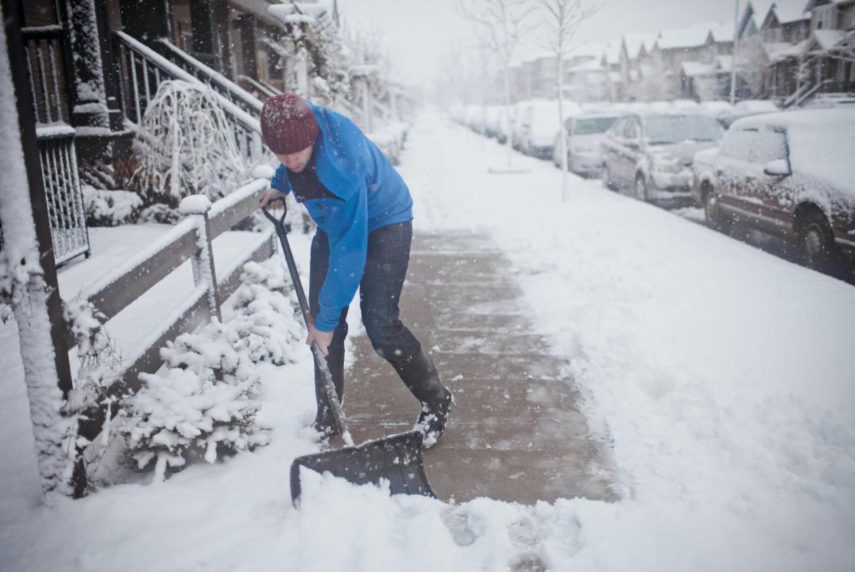 Viruses spread easier during the winter than other times of the year, but being outside isn't the main cause of transmission. <a href="https://www.gettyimages.com/detail/photo/man-shovels-the-sidewalk-outside-of-his-suburban-royalty-free-image/564190027?adppopup=true" rel="nofollow noopener" target="_blank" data-ylk="slk:Christopher Kimmel via Getty Images;elm:context_link;itc:0;sec:content-canvas" class="link ">Christopher Kimmel via Getty Images</a>