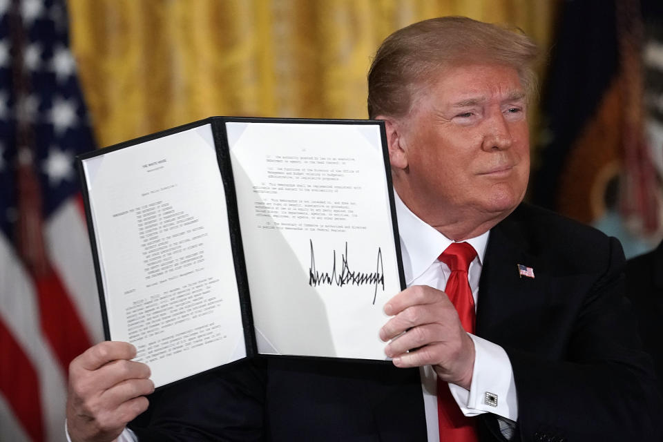 WASHINGTON, DC - JUNE 18:  U.S. President Donald Trump holds up an executive order that he signed during a meeting of the National Space Council at the East Room of the White House June 18, 2018 in Washington, DC. President Trump signed an executive order to establish the Space Force, an independent and co-equal military branch, as the sixth branch of the U.S. armed forces.   (Photo by Alex Wong/Getty Images)