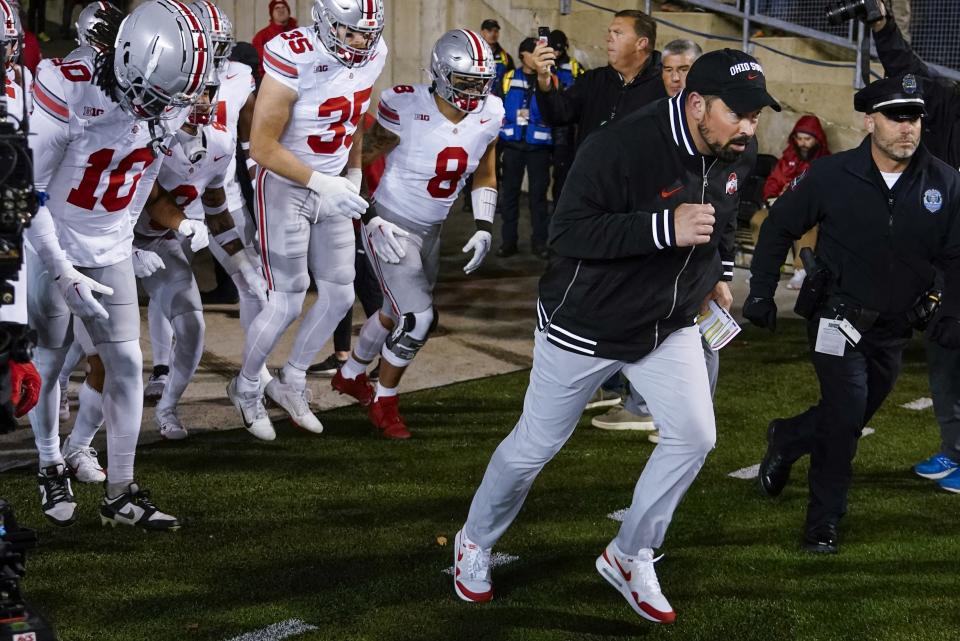 Ohio State head coach Ryan Day leads his team on the field before an NCAA college football game against Wisconsin Saturday, Oct. 28, 2023, in Madison, Wis. (AP Photo/Morry Gash)