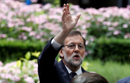 Spanish Prime Minister Mariano Rajoy waves as he waits for his car at the end of the second day of the EU Summit in Brussels, Belgium June 29, 2016. REUTERS/Phil Noble