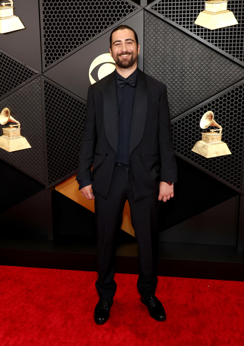 Noah Kahan in a black suit at the Grammys. (Image via Getty Images)