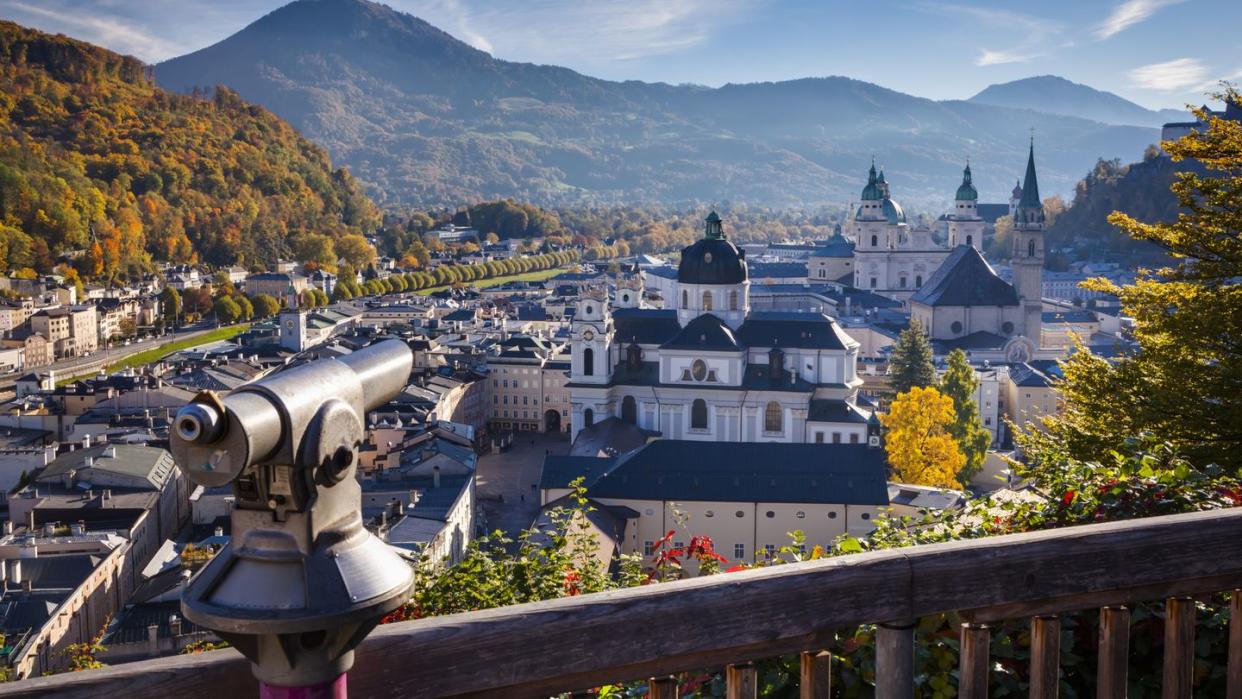 telescope overlooking the old town of salzburg from mönchsberg mountain salzburg, austria