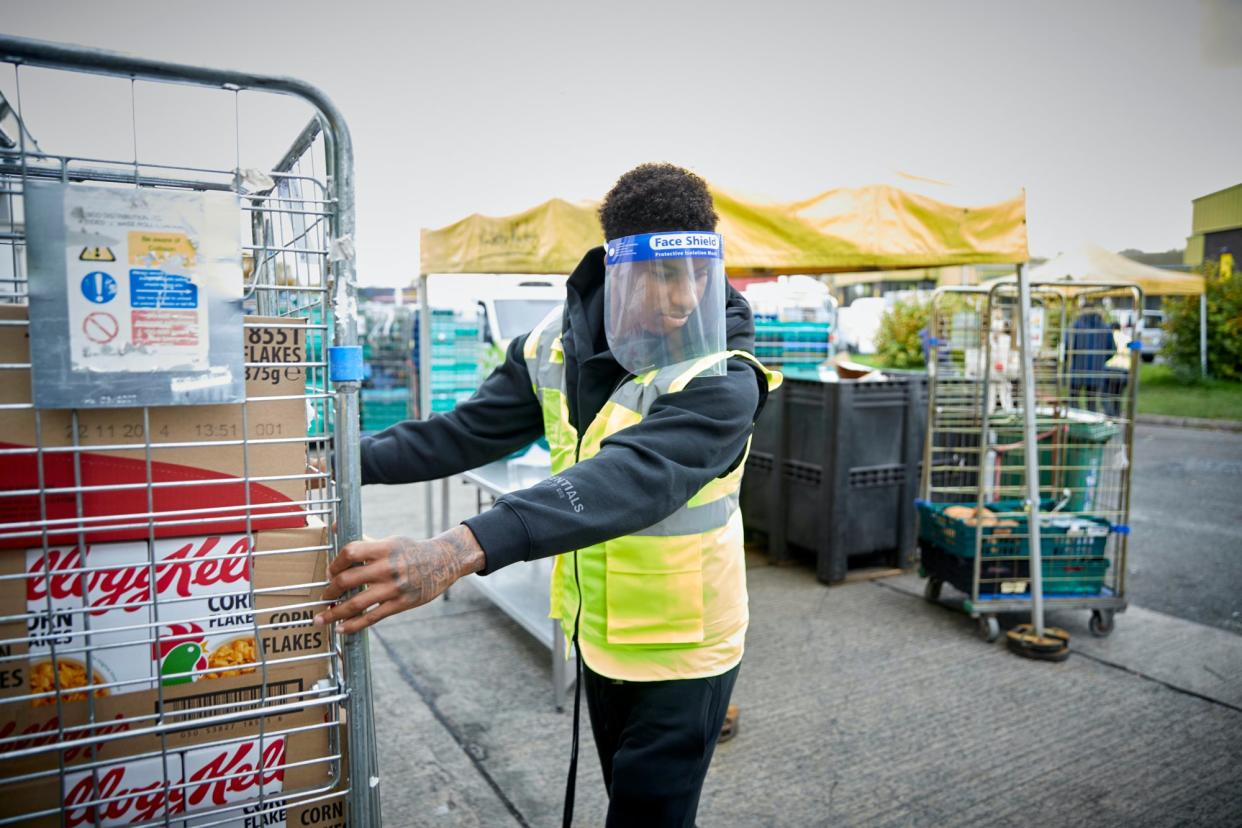 Marcus Rashford visits FareShare in Manchester (PA)