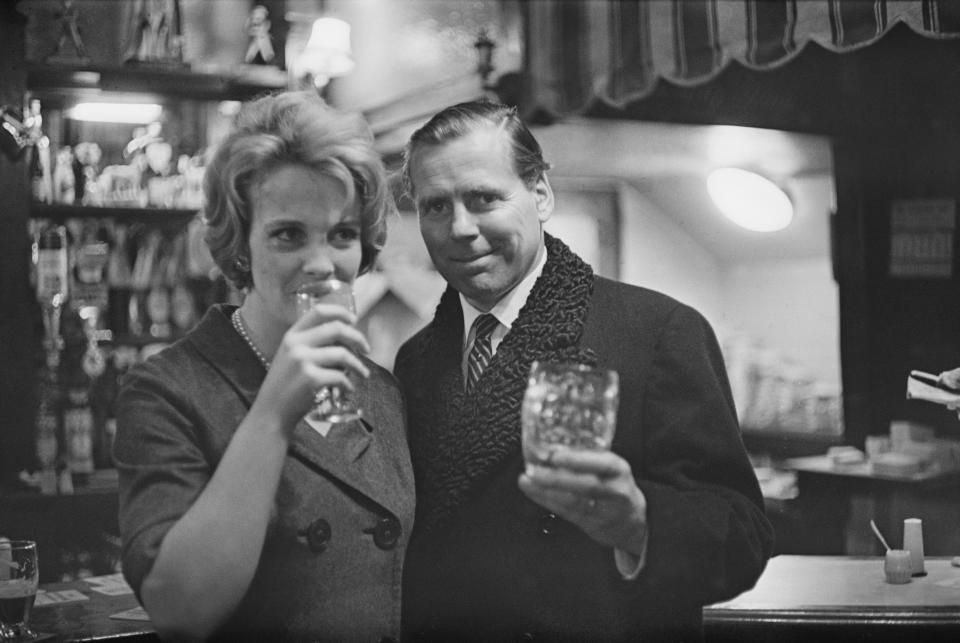 Kevin McClory pictured with his wife Frederica Sigrist having a celebratory drink in a pub bar 